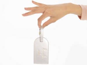 Katie Loxton Luggage Tag Forever Exploring Metallic Silver Hand